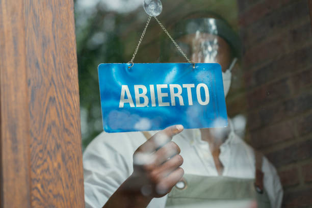 istock Man opening his business after COVID-19 quarantine 1281845445