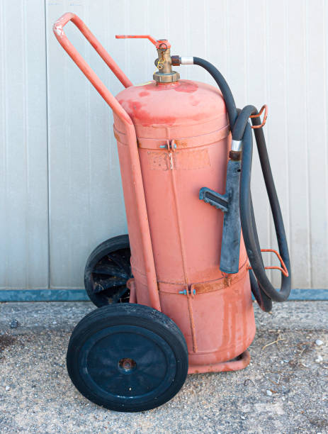 istock fire extinguishing system in the office. fire cylinders and transport trolley stand by the wall in an office building 1281845694