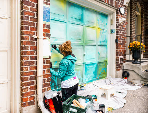 istock Female mural artist at work 1281847172