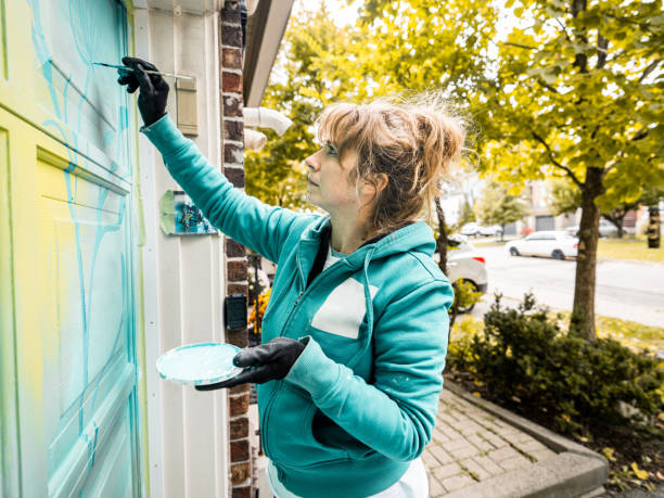 istock Female mural artist at work 1281848745