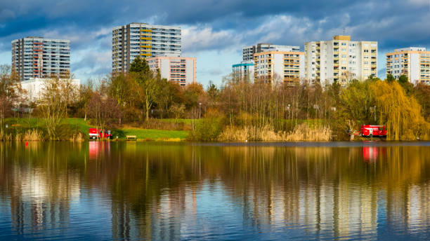 istock Landscape with lake and buildings 1281850988