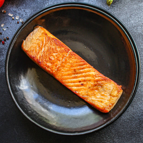 istock fried salmon fish bbq grill seafood portion fresh meal on the table  top view copy space for text food background rustic diet  pescetarian 1281852880