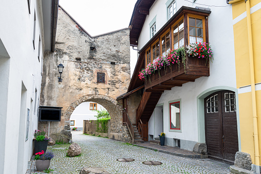 Gmünd in Kärnten, Austria - August 2020: Street and old gate in the historic town of Gmünd in Kärnten, Austria.