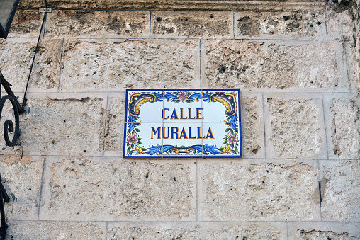 Cuba, Havana- March 23, 2018: The street sign of Calle Muralla