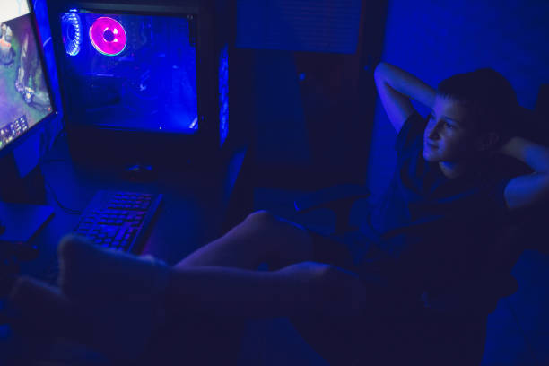 istock Teenager playing video game on PC 1281857544