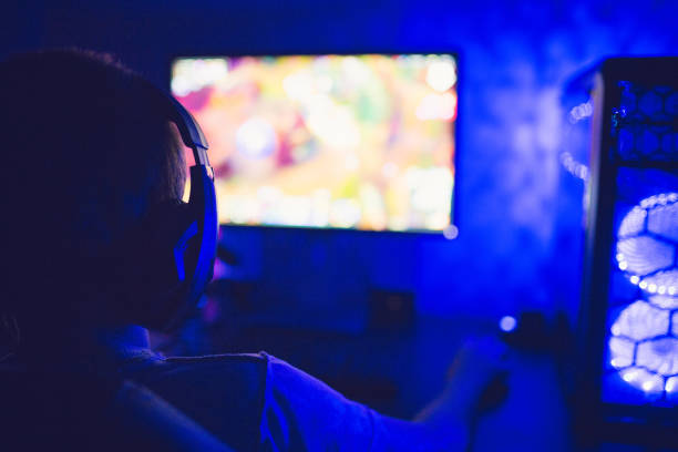 istock Teenage boy addicted to video 1281857574