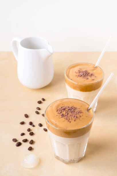 istock two transparent glasses of dalgon coffee on a wooden background 1281857643