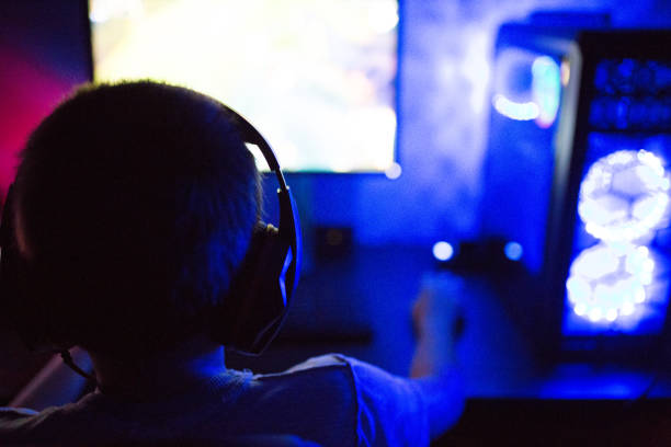 istock Teenage boy addicted to video 1281857663
