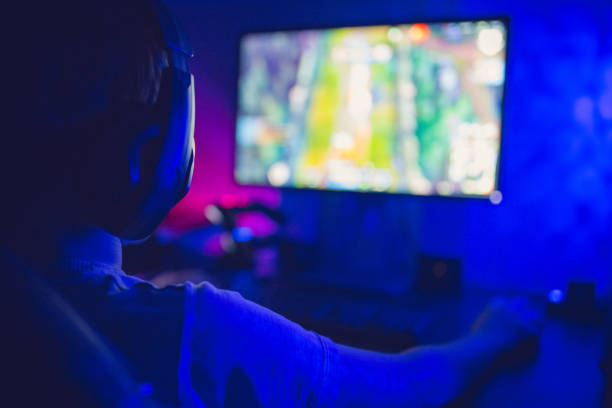 istock Emotional kid play computer games online 1281858463