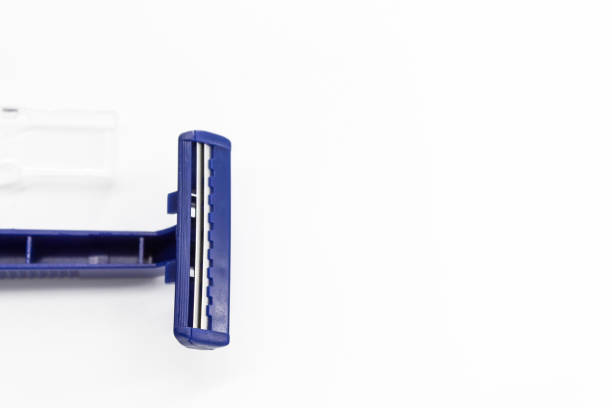 istock One male razor for one-time use rests on a white background 1281860120