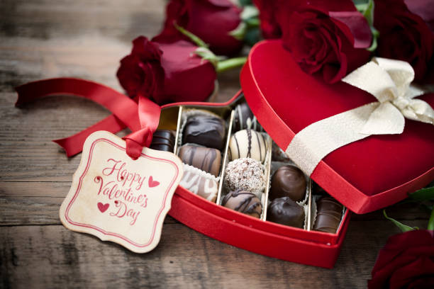 istock Valentine's Day Box of Chocolates and Red Roses 1281862198