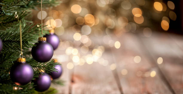 istock Christmas Tree, Purple Baubles with Lights Background 1281862318