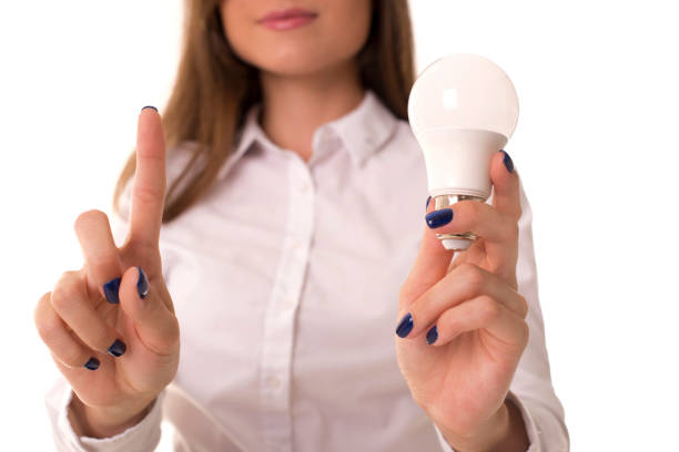 istock Business woman with light bulb in her hand. 1281862442