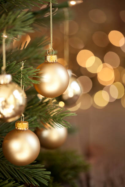 istock Christmas Tree, Gold Baubles with Lights Background 1281862622