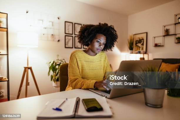 Young African American Businesswoman At Home Office Working Late Stock Photo - Download Image Now
