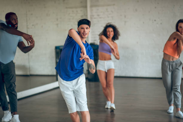 istock Teacher showing new dance routine to his students 1281862717