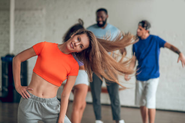 istock Smiling and confident woman making dance movements 1281862803