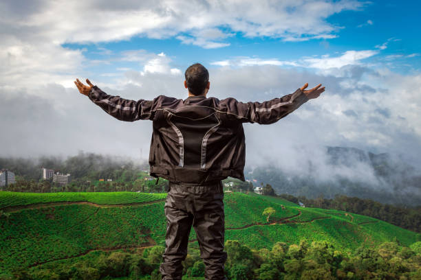 istock man showing his beautiful expression above tea garden 1281863592