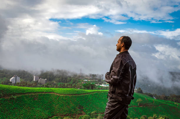 istock man showing his beautiful expression above tea garden 1281863600