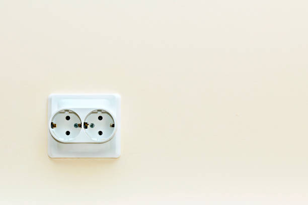 istock white double electrical outlet on a beige wall 1281863660