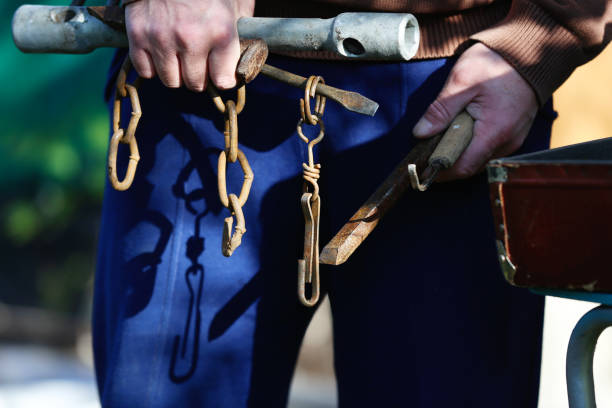 istock Man's hands holding vintage household tools 1281864179