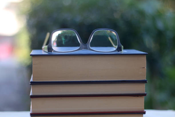 istock Books and Reading Glasses 1281868119