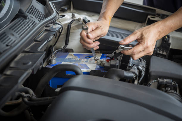 istock Engine engineer is replacing  car battery because car battery is depleted. concept car maintenance And the cost of car care. 1281869013