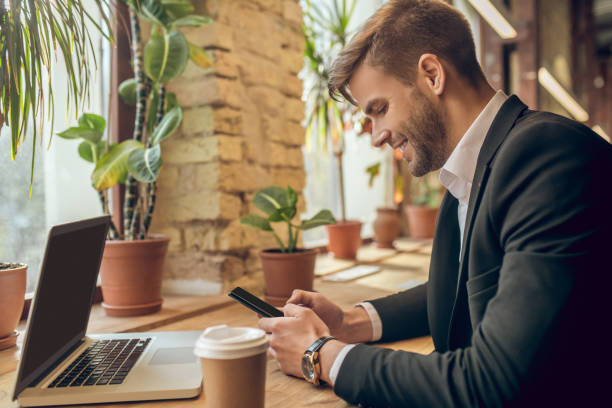 istock Young businessman holding a smartphone and texting 1281869998