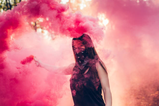 istock Woman holding smoke fountain 1281870589