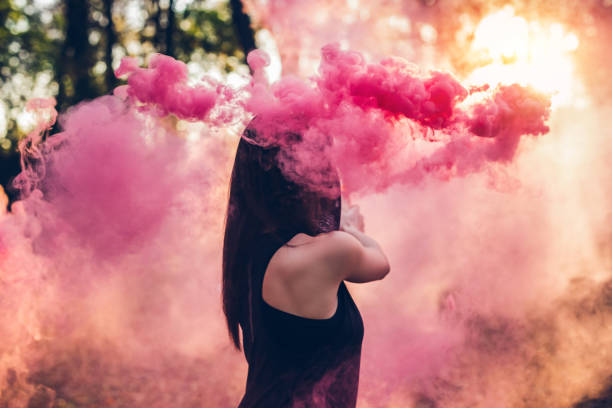 istock Woman holding smoke fountain 1281871206