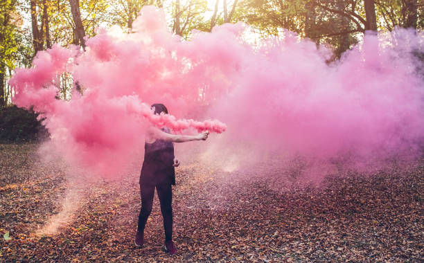 istock Woman holding smoke fountain 1281871220
