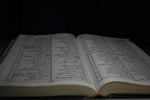 Open Urdu Bible showing Psalms