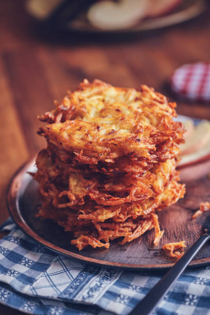 istock Preparing Rosti Potato Pancake in Domestic Kitchen 1281872612