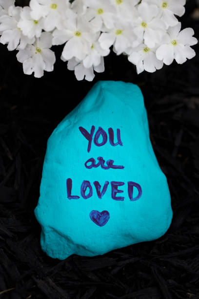 istock Blue rock painted with the words, 