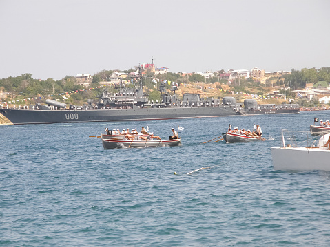 Navy frigate moored at naval dockyard.