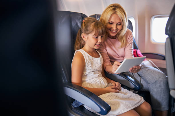 istock Mother showing her daughter something exciting on a tablet screen 1281875401