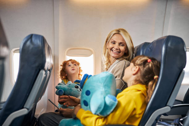 istock Optimistic mother looking lovingly at her daughter with a toy 1281875467