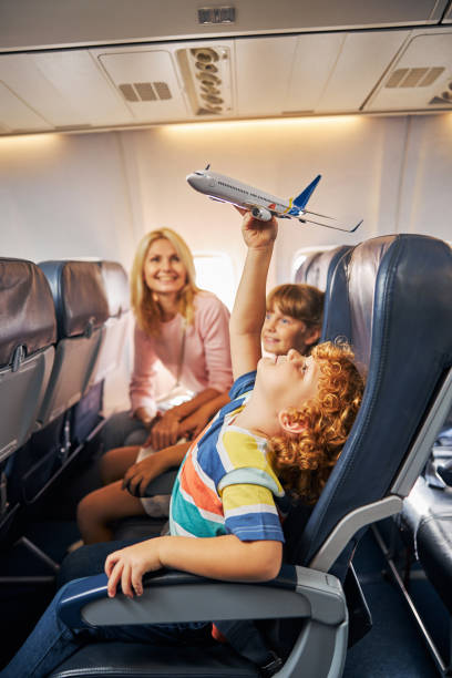 istock Boy raising a toy aircraft over his head 1281875483