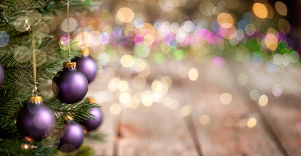 istock Christmas Tree, Purple Baubles with Defocused Lights Background 1281877029