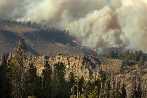 Flames and a fire tornado or fire whirl devour sagebrush and pines in the Arapahoe National Forest and Rocky Mountain National Park in Colorado’s second largest wildfire, the East Troublesome Fire burning just outside Hot Sulphur Springs.