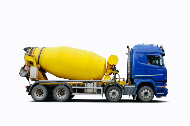 blue and yellow cement mixer truck in motion - truck motion road cement truck imagens e fotografias de stock