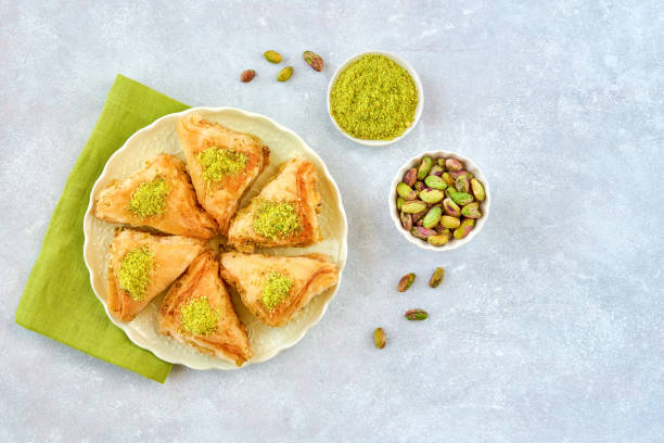 istock Sweets arabic dessert baklava, , kunafa, kadayif with pistachio and cheese . Top view, copy space 1281880766