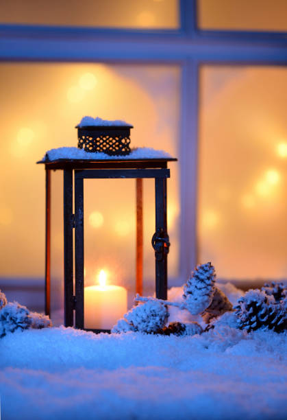 istock lantern with candle in house exterior with snow 1281880962