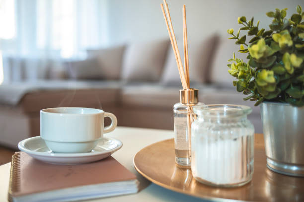 istock Coffee, candles, book and aroma reed diffuser on table at home 1281882546