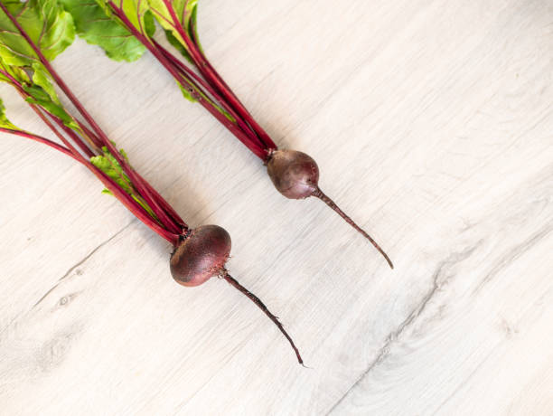 Fresh beautiful washed beets on a light background