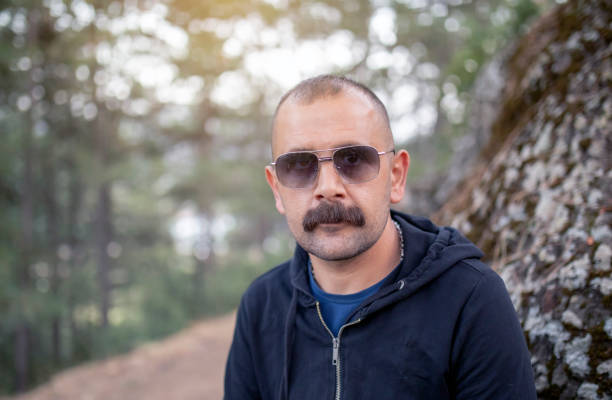 Man posing in autumn park