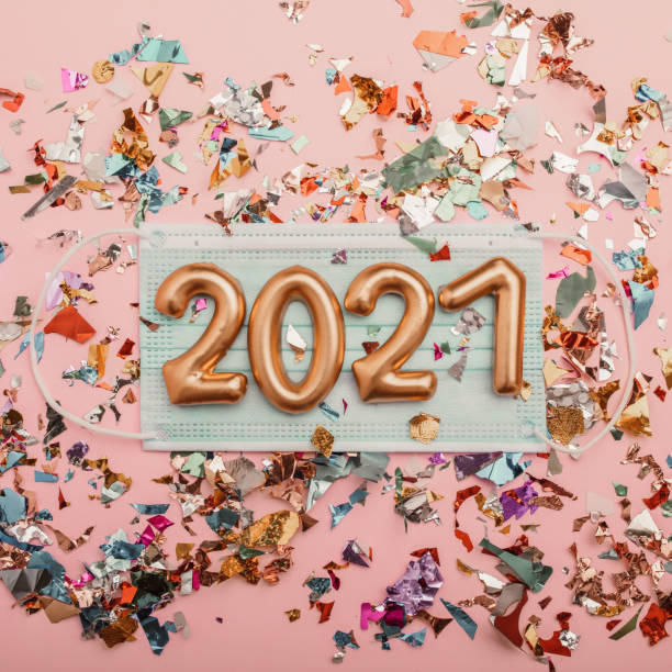 istock Happy new year 2021 with face mask and confetti 1281897159