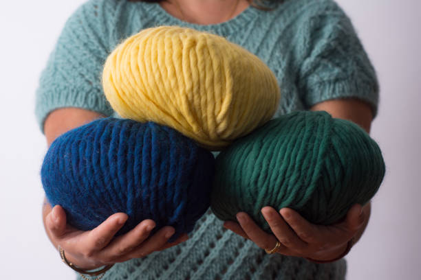 istock Close plane of a woman's hands holding colored balls. 1281898762