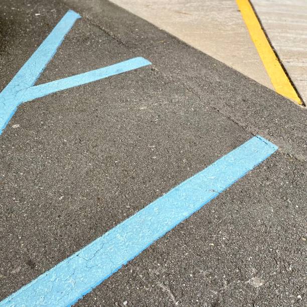 istock Alternative commute - Wheelchair parking spot abstract background close-up 1281905070
