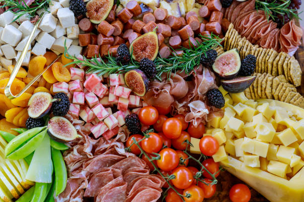 istock Charcuterie board with cheese, fig, and crackers. 1281906437